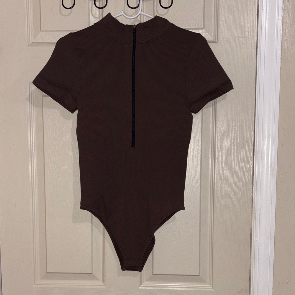 Brown woman body suit